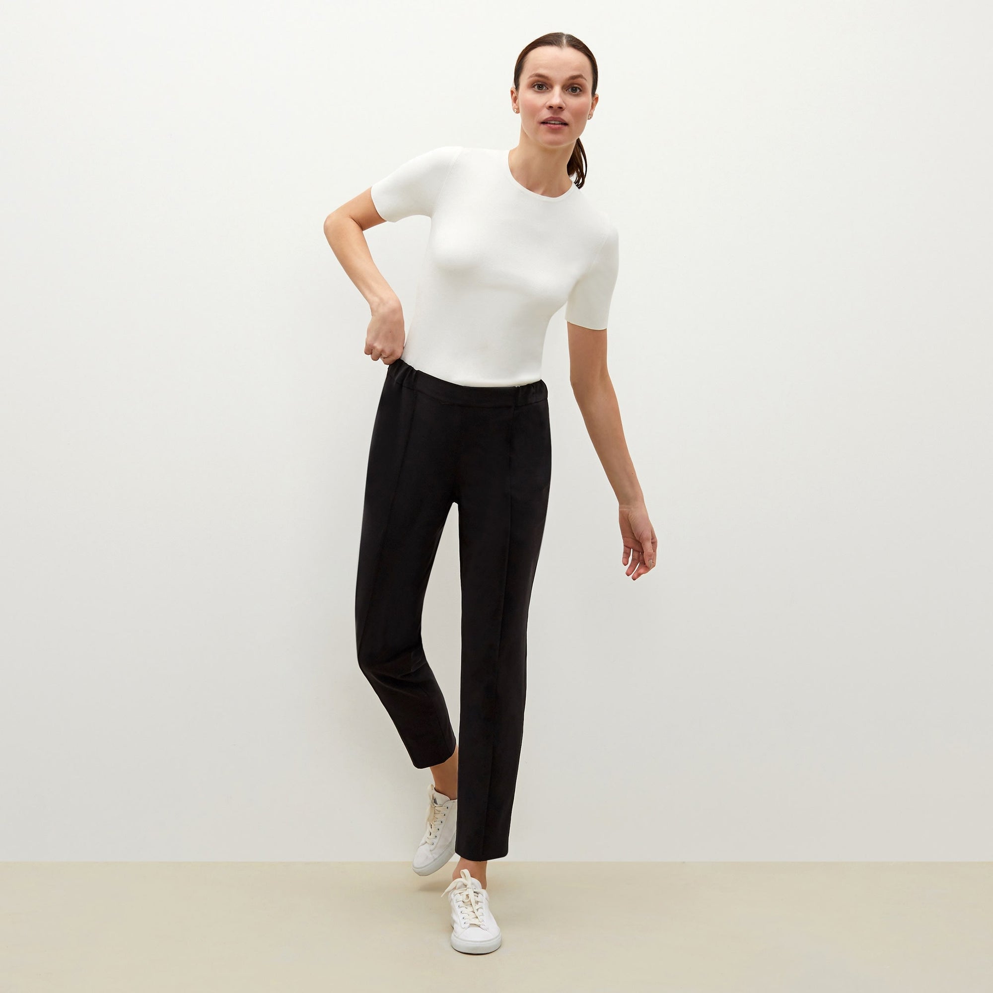 Front image of a woman standing wearing the Colby Jogger in Black | Exclude