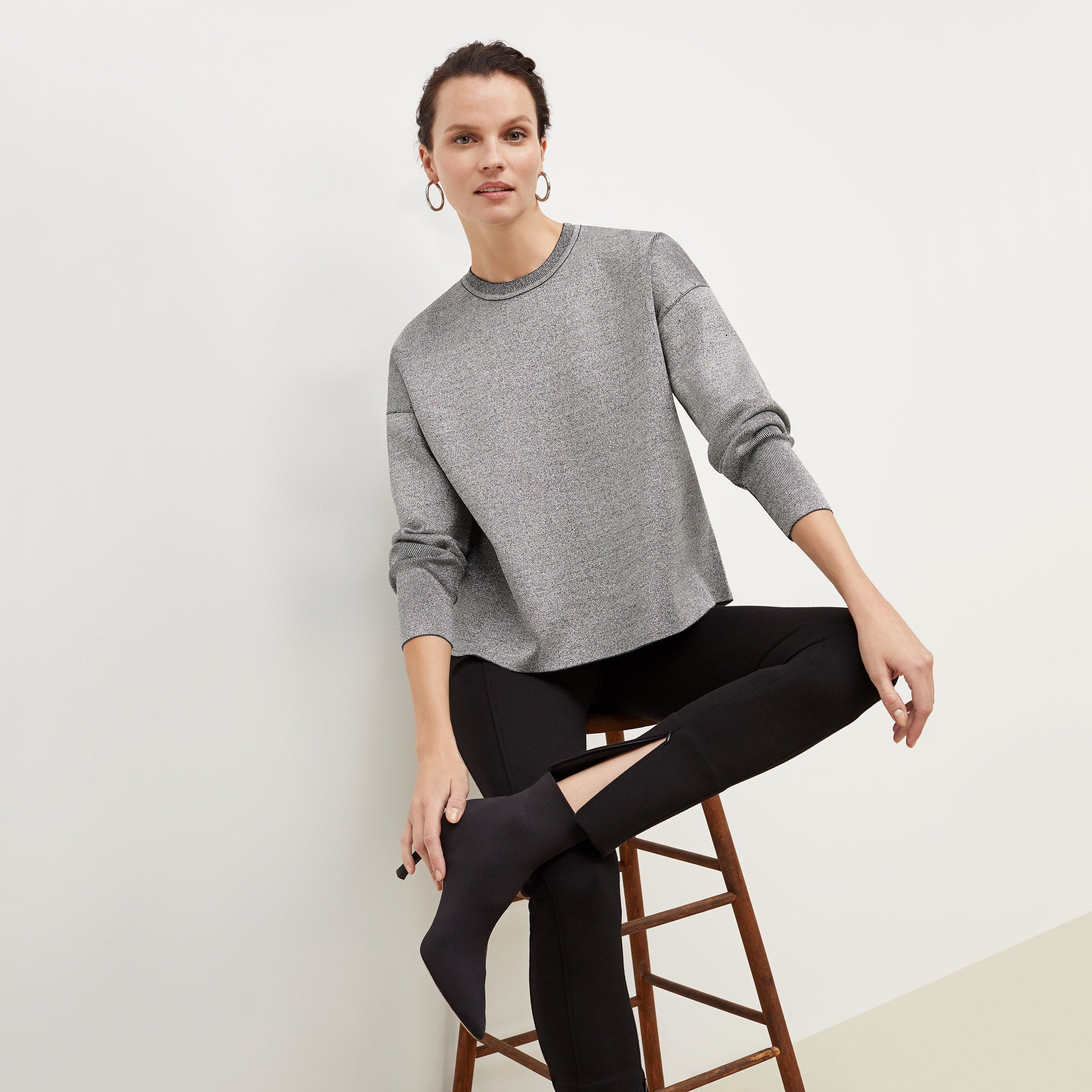 Front image of a woman standing wearing the Curie Pant--Worth in Black