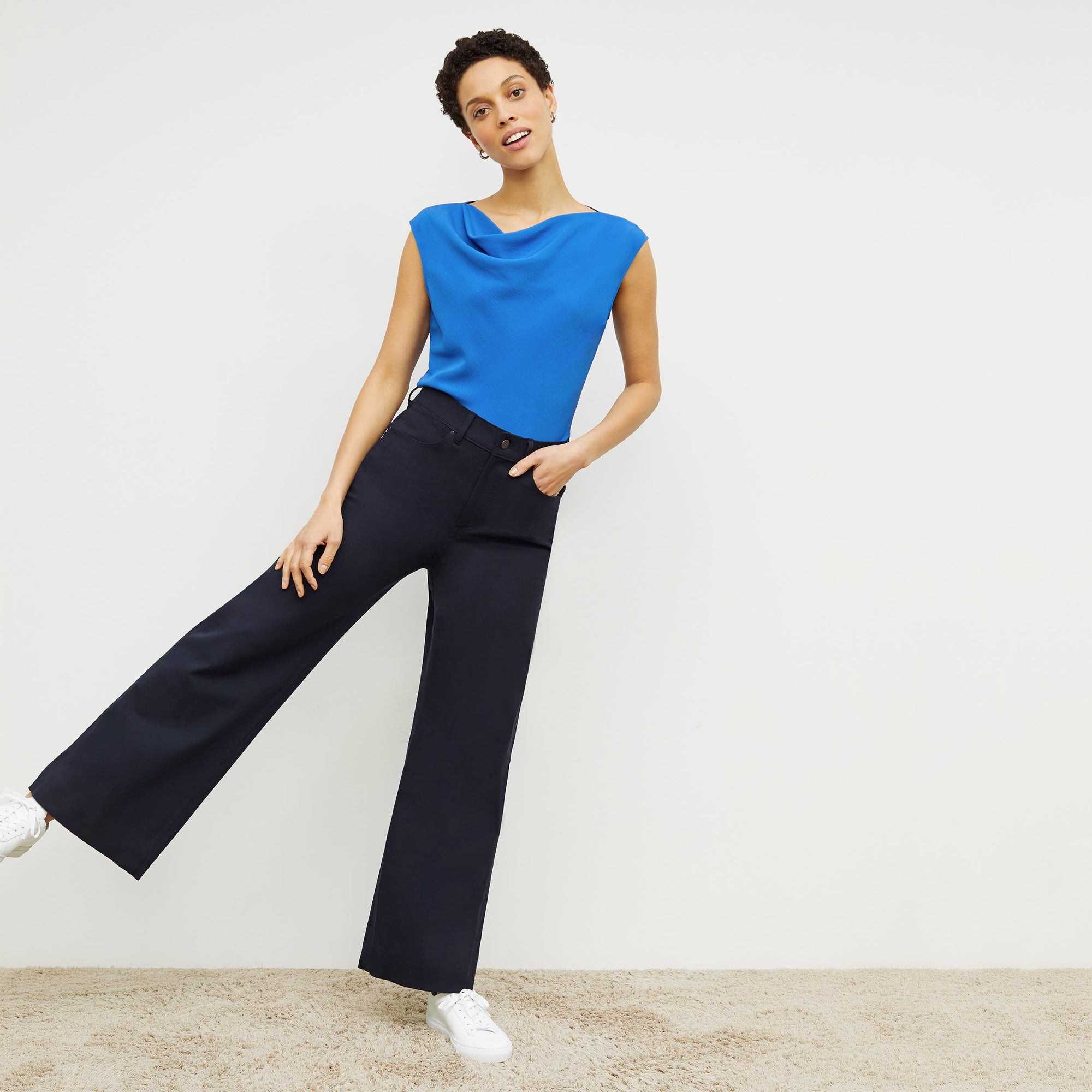 Front image of a woman standing wearing the Milo Jean in ink | Exclude