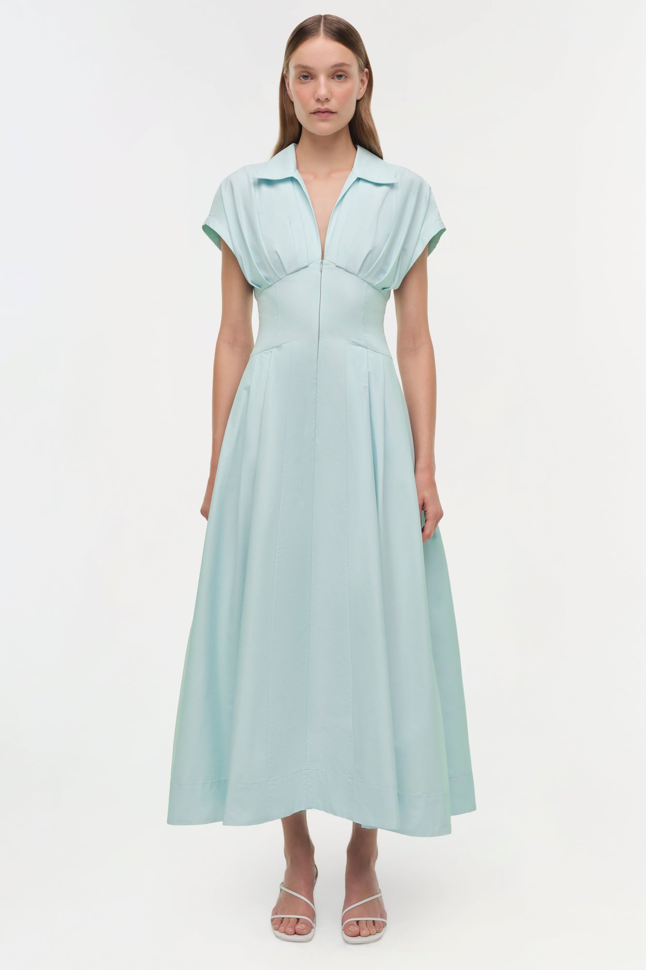 Light blue cotton faille midi dress with collared neckline, short sleeves, and A-line skirt on model wearing white sandals.
