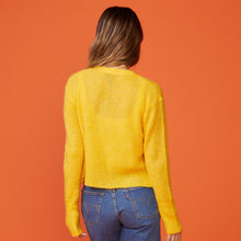 Back view of model wearing the mohair cardigan in sunshine.