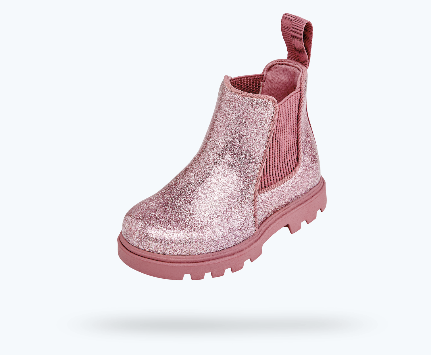 Angled view of a Native Shoes Kids Kensington Treklite Glitter Kids | Pink Glitter/ Temple Pink Footwear