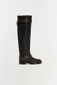 Black leather over-the-knee boot with gold buckle straps and flat sole.