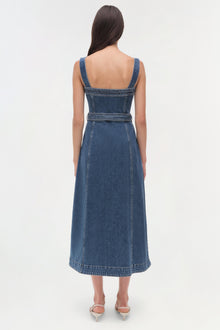 Blue denim sleeveless dress with square neckline, belted waist, and A-line skirt shown from back view.