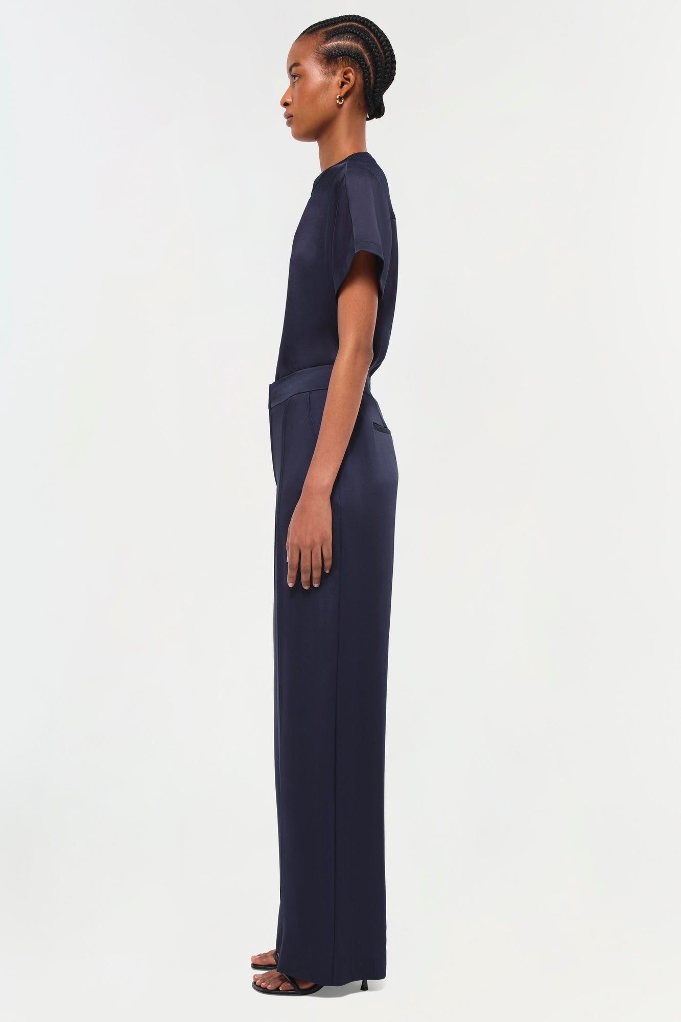 Navy t-shirt with short sleeves and matching wide-leg pants, shown on model in side profile.