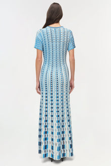 Blue and white eyelet knit midi dress with short sleeves, shown on model from back view.
