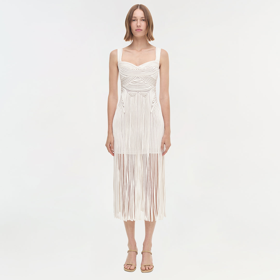 White sleeveless midi dress with geometric striped pattern and pleated fringe hem.