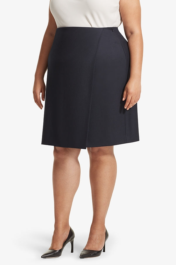 Front image of a woman standing wearing the Logan skirt sharkskin in Ink | Plus | Exclude