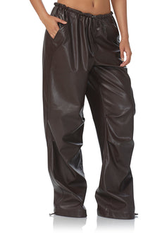 women's faux leather parachute style pant with adjustable hem details, and a oversized fit in java