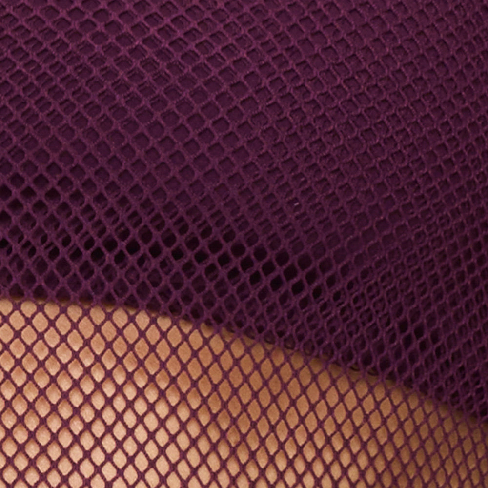 Close-up fabric swatch of the Zani Top in plum, showing the plum-colored ribbed textile texture.