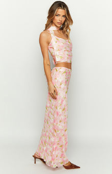 Side view of a pink floral print maxi skirt with a flowy silhouette