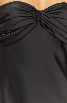 Rear view of a black strapless satin maxi dress with a smooth, flowing skirt