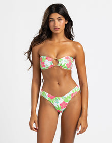 model is wearing bethany bandeau in pink jungle floral print
top has a gold ring in the center
top ties at back
top is paired with matching tango bottom
