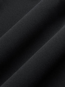 Close-up of Melt fabric in black, soft and smooth texture.