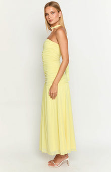 Side view of a yellow strapless ruched maxi dress with a flowy skirt and a choker neck tie