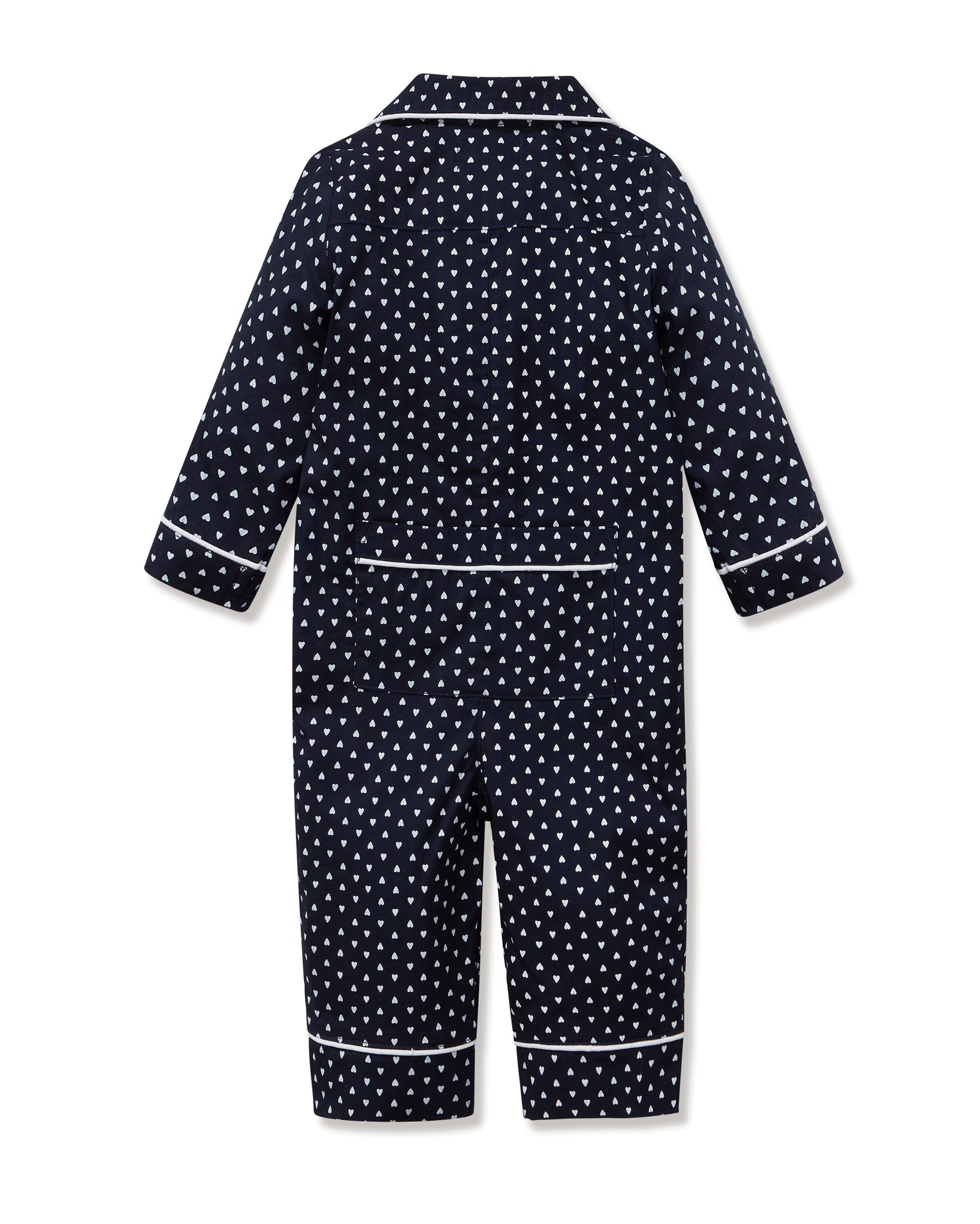 The Baby's Twill Classic Romper in Midnight Hearts is a navy blue onesie with long sleeves and legs, featuring a white heart pattern and white piping on the collar, cuffs, and front.