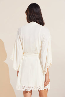 Model wears Naya TENCEL Modal Robe in ivory.