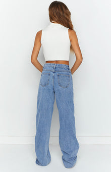 Rear view of light blue wide-leg jeans showing back pockets, belt loops, and a relaxed fit
