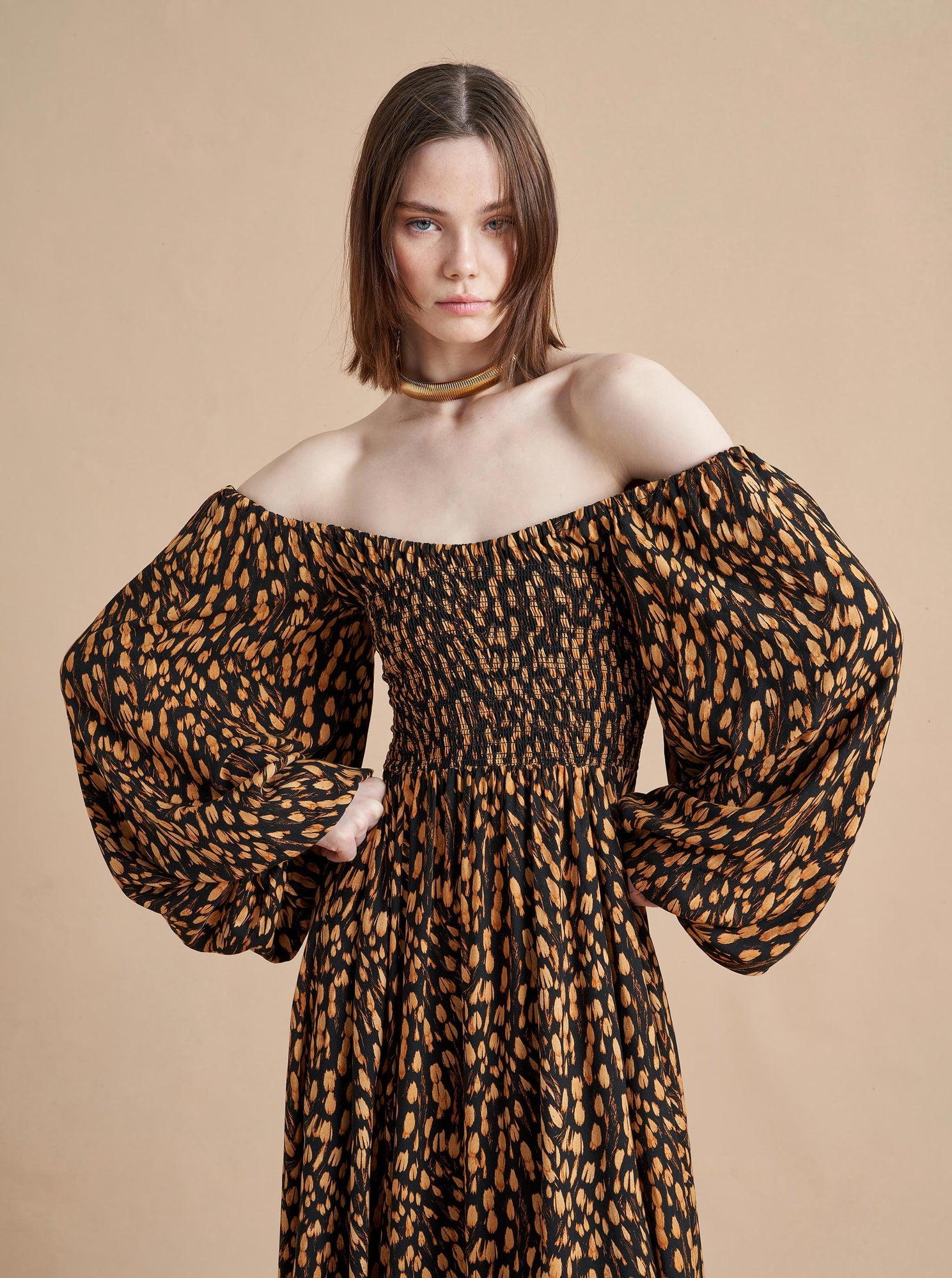 Our new Elsa Dress, in a conceptual animal print, is the perfect transition into colder weather with long balloon sleeves that can be worn either up or off the shoulder and a perfectly positioned slit to show off some skin. Pair with your favorite boots and fall in love.