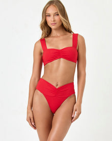 Flame | Badge:Eco-Friendly_#B2AC88_#ffffff'
Woman wearing a red bikini set on a white background
