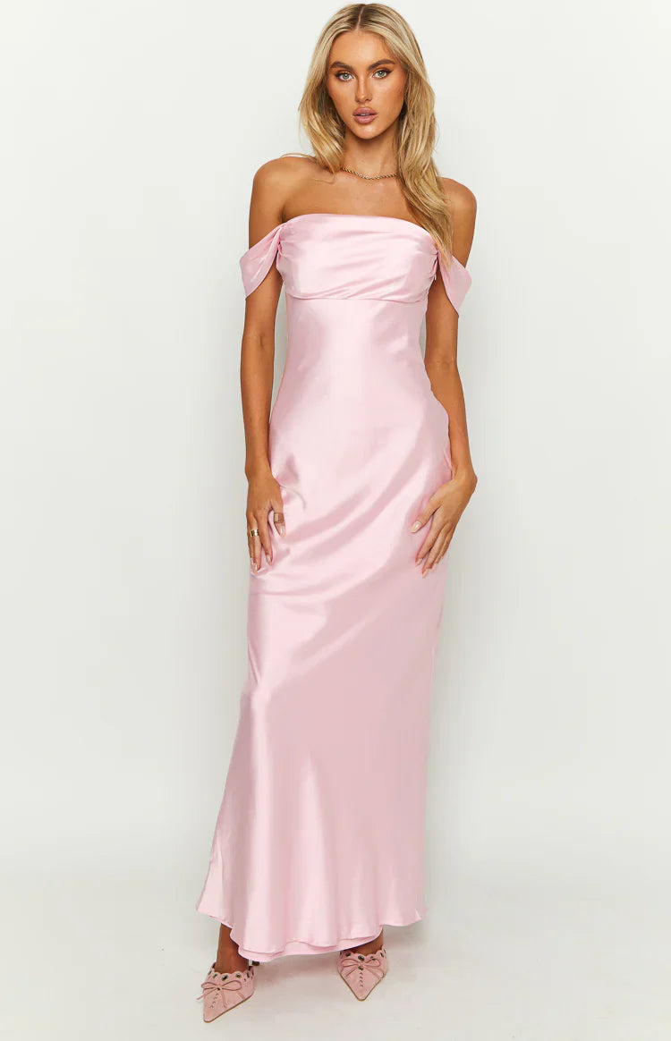 Full front view of a light pink off-shoulder satin maxi dress with draped sleeves and a fitted bodice