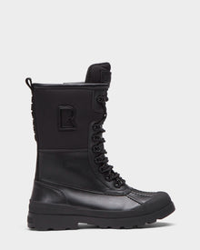 The Rudsak RITA - L222502 Black is a women’s high-top black winter boot with weather-treated leather upper, lace-up front, rugged sole, reinforced toe, and side logo patch, shown from the side on a white background.