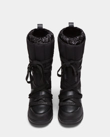 The RODIN - 8224502 Black womens winter boots by Rudsak feature thick anti-slip soles, a quilted upper, crisscross laces, and the Rudsak logo embossed on the front. Shown from a top-down view.