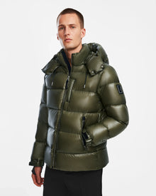 A man in a Rudsak VINCE S - 6124560 Loden Green down puffer coat.