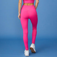 Back View of model wearing the Movement High Rise Legging in Raspberry