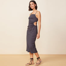 Side view of model wearing the linen slip dress in faded black.