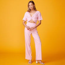 Front view of model wearing the linen front twist top in bubble gum.