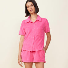 Front view of model wearing the terry cloth pocket shirt in azalea.