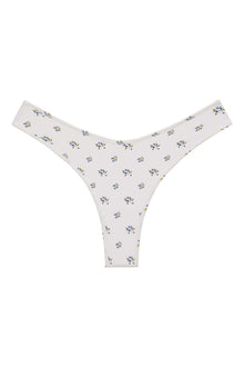 White bikini bottom with small blue and yellow floral print throughout.