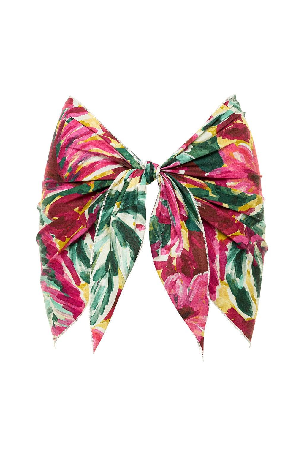 Colorful floral sarong with pink, yellow, and green botanical print, tied at center with pointed ends.
