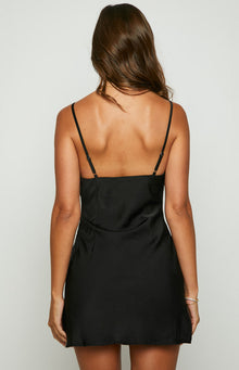 Back view of a black mini dress with thin adjustable spaghetti straps