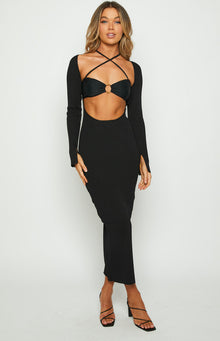 Black ribbed knit maxi dress with long sleeves, thumbholes, waist cutouts, and a separate criss-cross strap bra top