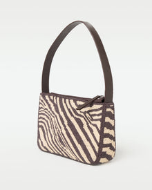 Side view of the animal print Alora Bag showing the structured silhouette.