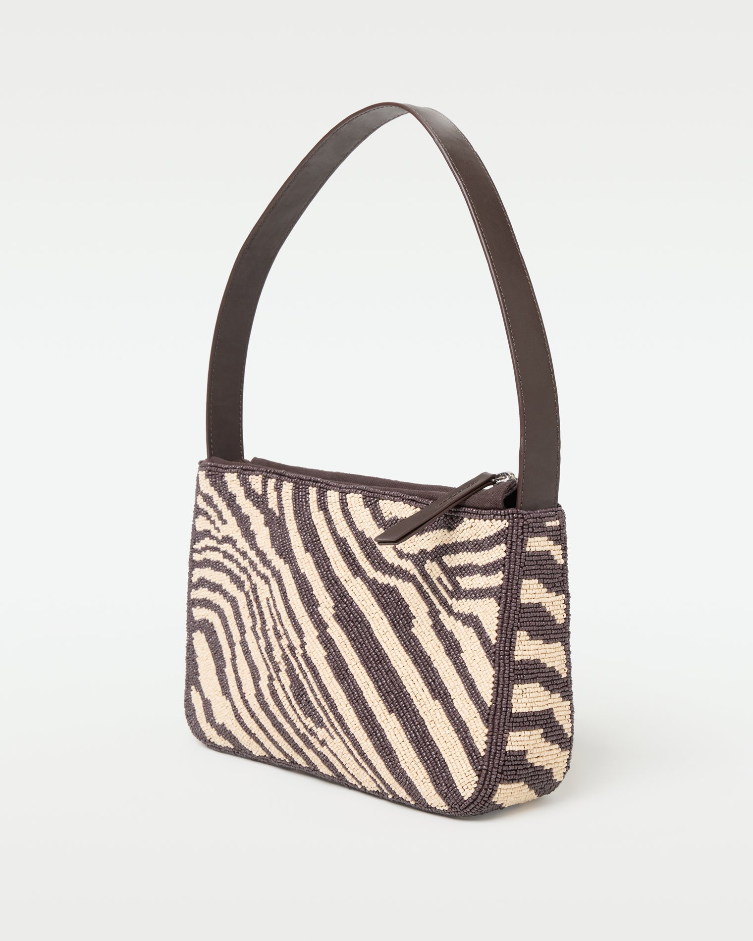 Side view of the animal print Alora Bag showing the structured silhouette.