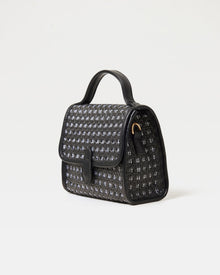 Angled view of the Amelia Bag in black showing the structured silhouette and woven detail.