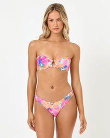 front view of woman wearing a colorful bikini set on a white background
