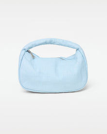 Off-model front view of the Mendoza Bag in sky blue, a structured woven crescent hobo bag with a short curved top handle and silver zipper closure, on a white background.