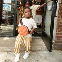 Boy wearing STATE Bags Novelty Fanny Fuzzy Basketball