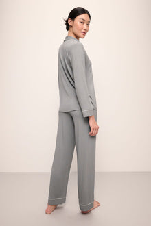 Model wears Gisele TENCELâ„¢ Modal Long PJ Set in moonlight/ivory.