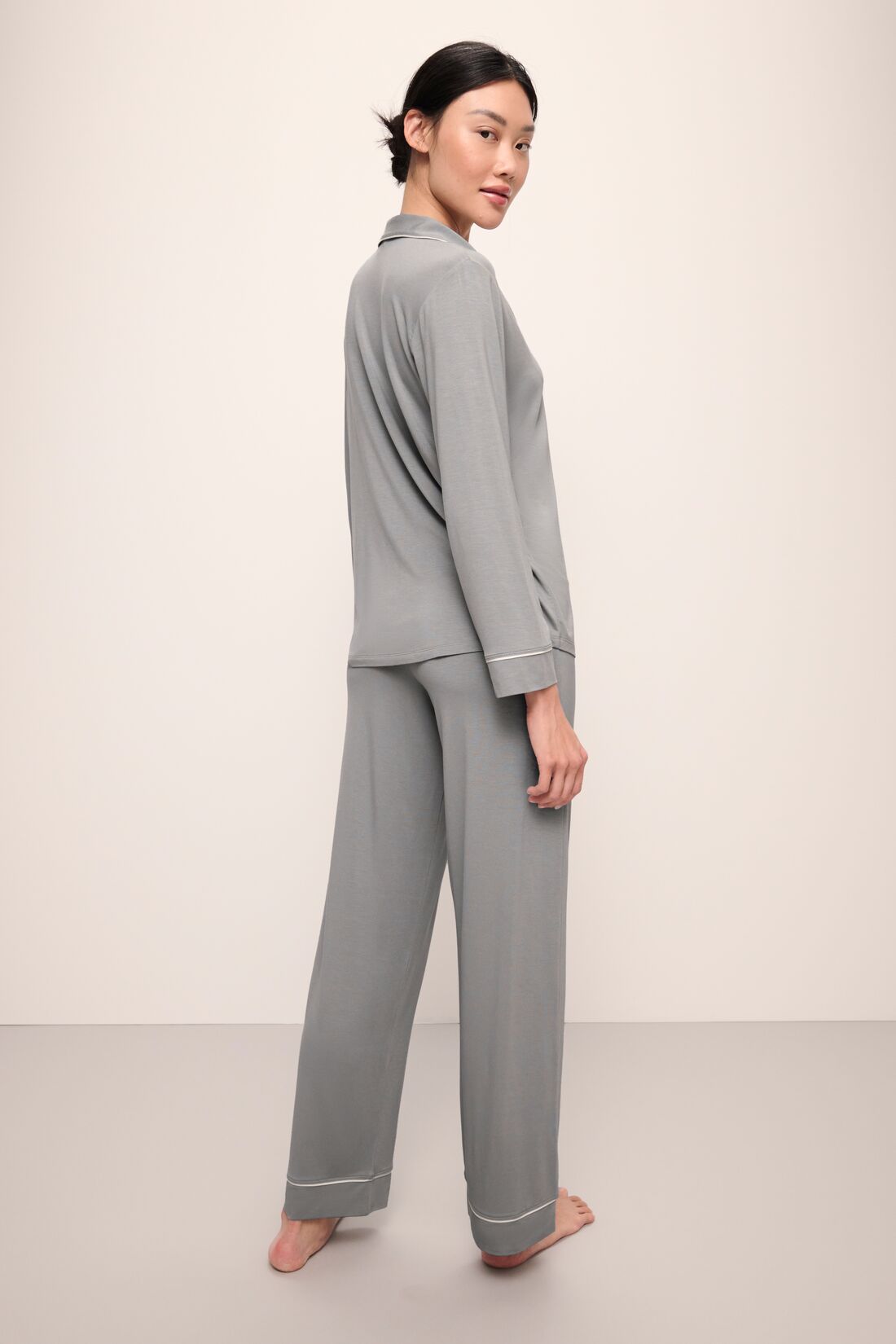 Model wears Gisele TENCELâ„¢ Modal Long PJ Set in moonlight/ivory.