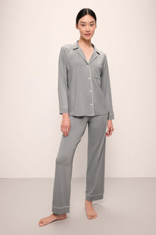 Model wears Gisele TENCELâ„¢ Modal Long PJ Set in moonlight/ivory.