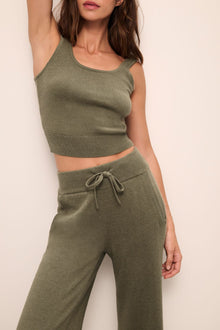 Model wears the Recycled Sweater Cropped Tank in Moss.