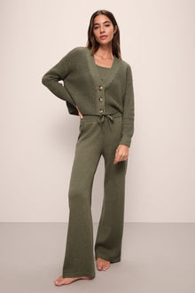Model is Wearing the Recycled Sweater Cropped Cardigan in Moss.