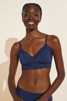 Model wears Rosalia TENCELâ„¢ Modal Bralette in Navy.
