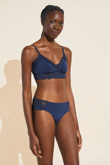 Model wears Rosalia TENCELâ„¢ Modal Bralette in Navy.