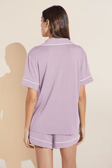 Model wears Gisele TENCELâ„¢ Modal Relaxed Short PJ Set in lavender/ivory.